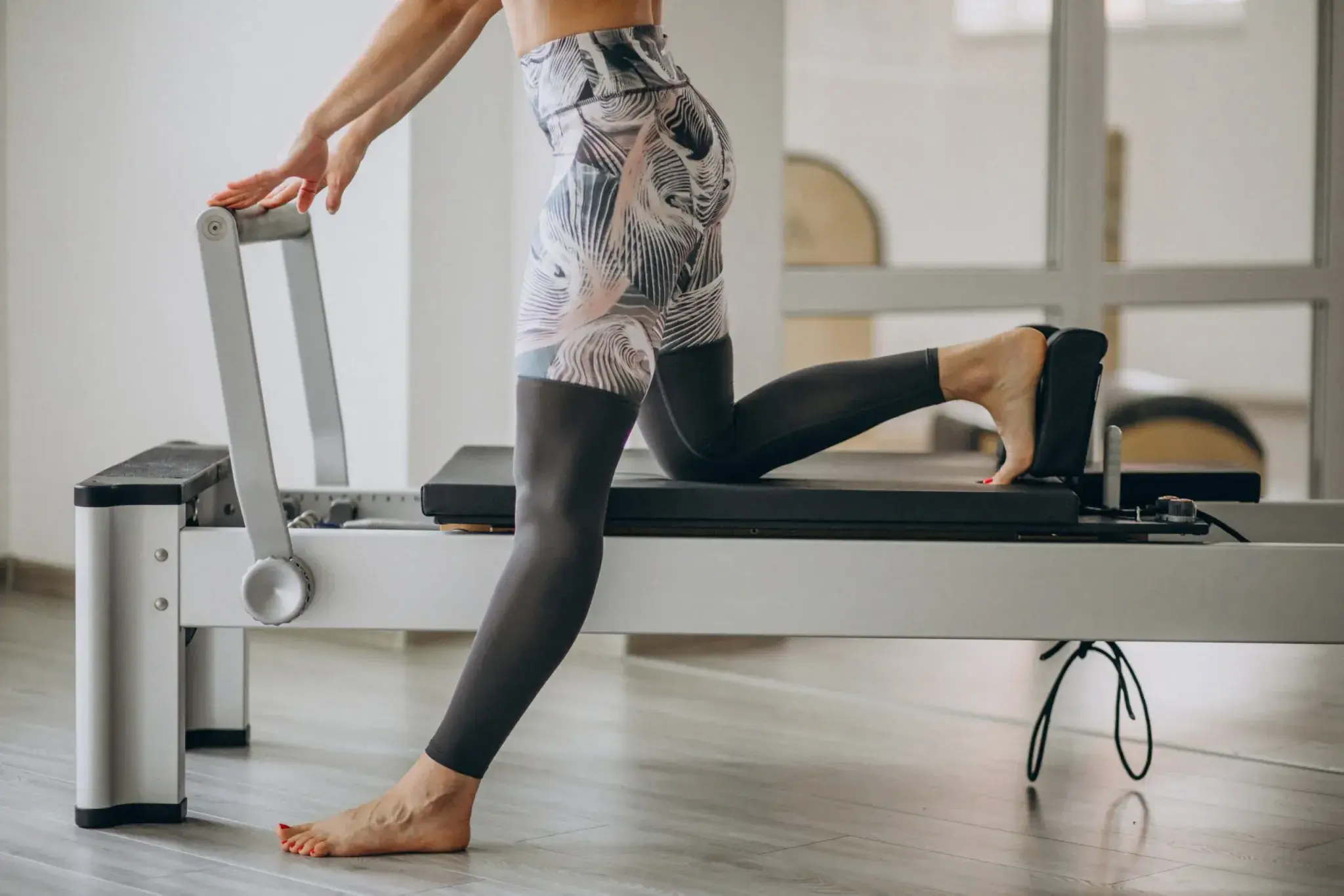 Cvičení pilates na reformeru